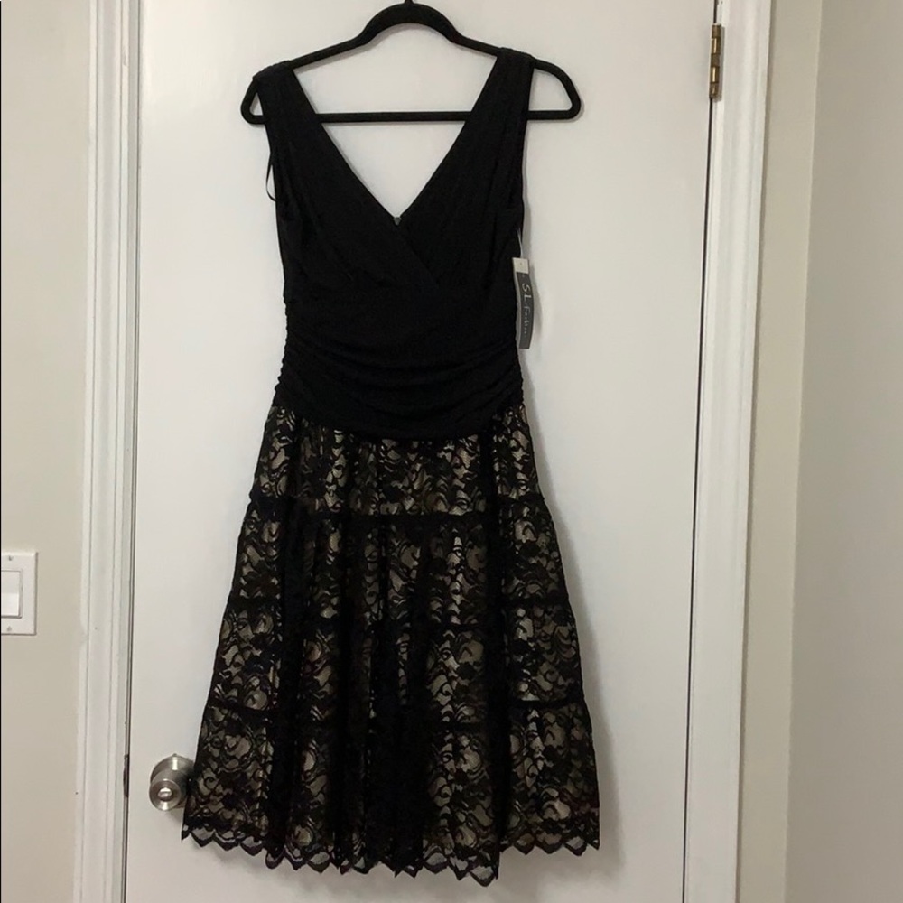 Black Dress with lace bottom and ruched top.